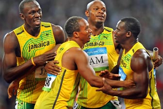 Usain Bolt, Michael Frater, Asafa Powell, Nesta Carter (li.) gewannen Gold in Peking - diese Medaille wird ihnen nun weggenommen.