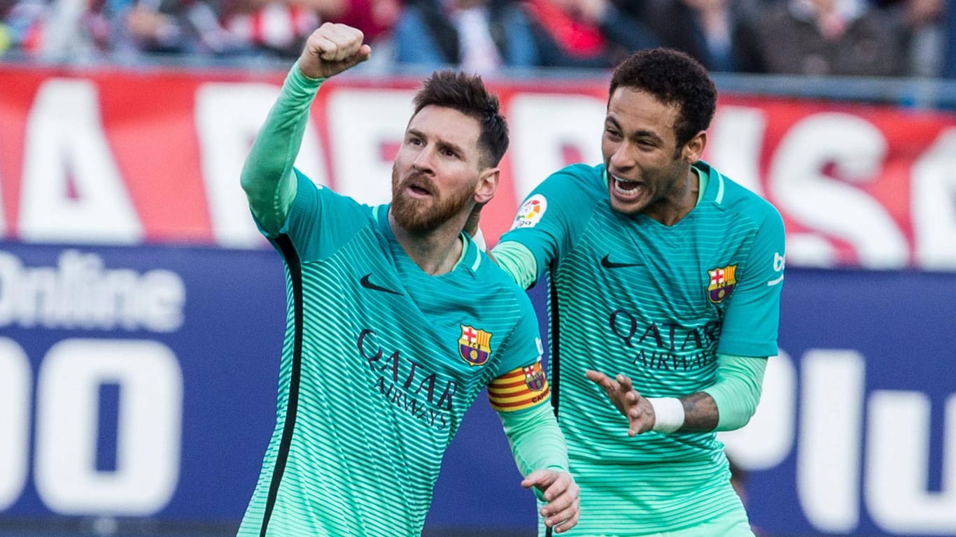 Leo Messi (li.) und Neymar bejubeln den Siegtreffer gegen Atletico.