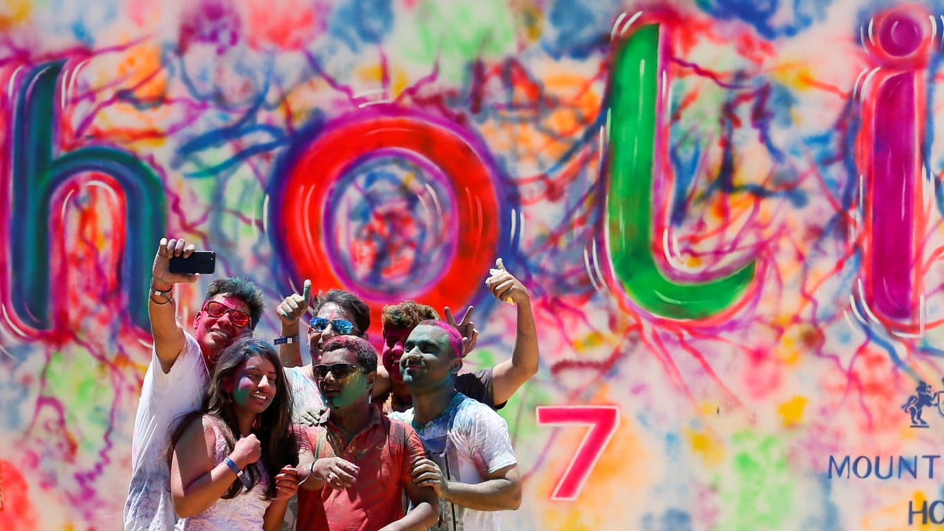 A group of youths take selfies during Holi, the Festival of Colours organised by "Colombo Indians", Indians who live in Colombo, in Colombo