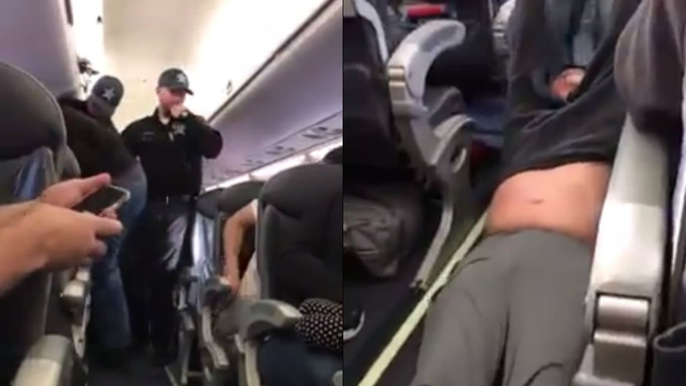 Ein Passagier wird gewaltsam aus einem überbuchten Flugzeug entfernt.
