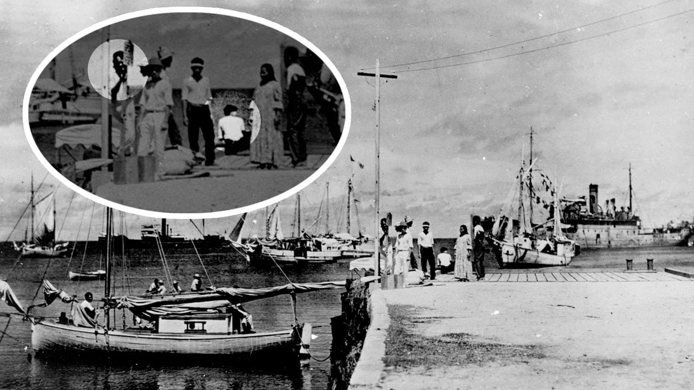 Die auf dem Pier hockende Frau soll Amelia Earhart sein. Links auf der Anlegestelle soll Earharts Navigator Fred Noonan stehen.