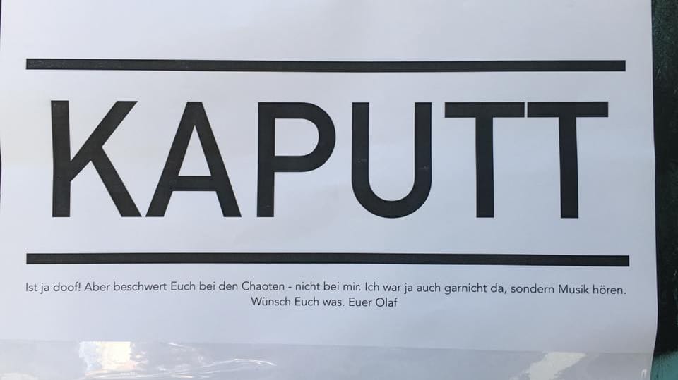 Vorwurf an Hamburgs Bürgermeister Olaf Scholz: Im Schanzenviertel hängen nach den Krawallen an zerstörten Geschäften und Bankautomaten Flugblätter.