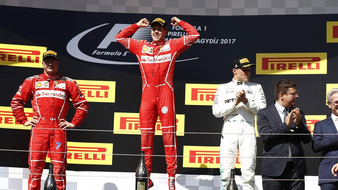 Sebastian Vettel gewinnt den Großen Preis von Ungarn vor Teamkollege Kimi Räikkönen (l.) und Mercedes-Pilot Valtteri Bottas.