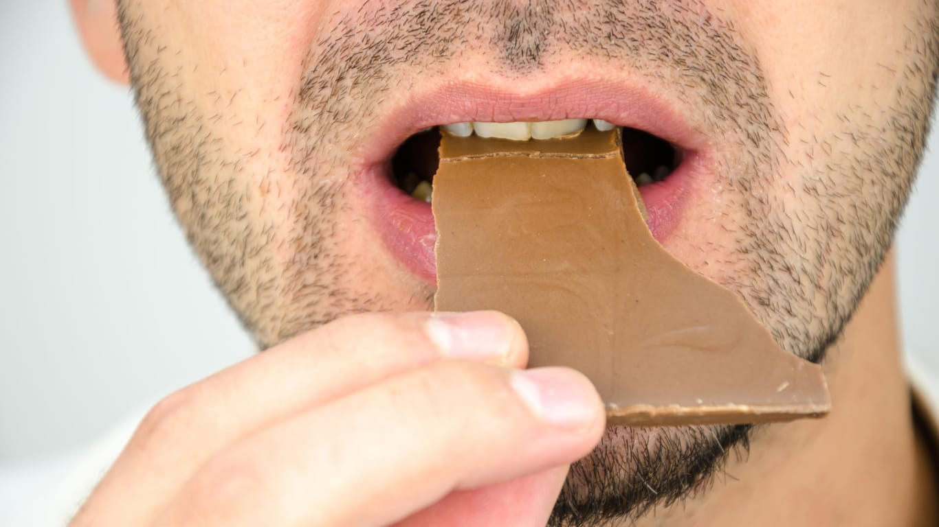 man eating chocolate