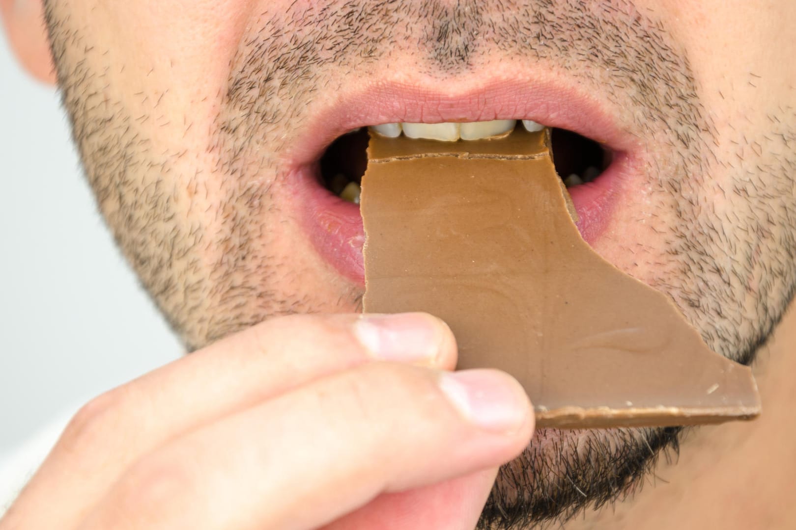 man eating chocolate