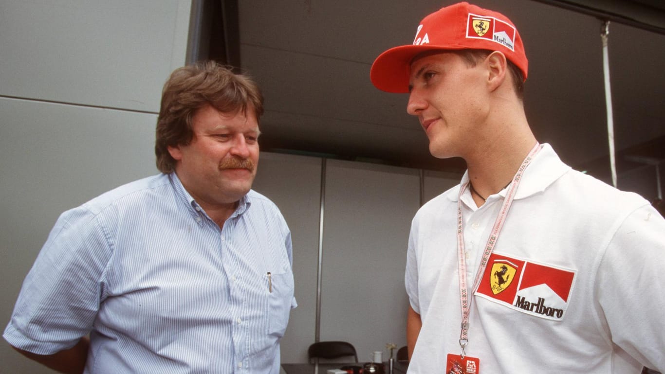 Michael Schumacher (rechts) und Norbert Haug im Jahre 1997.