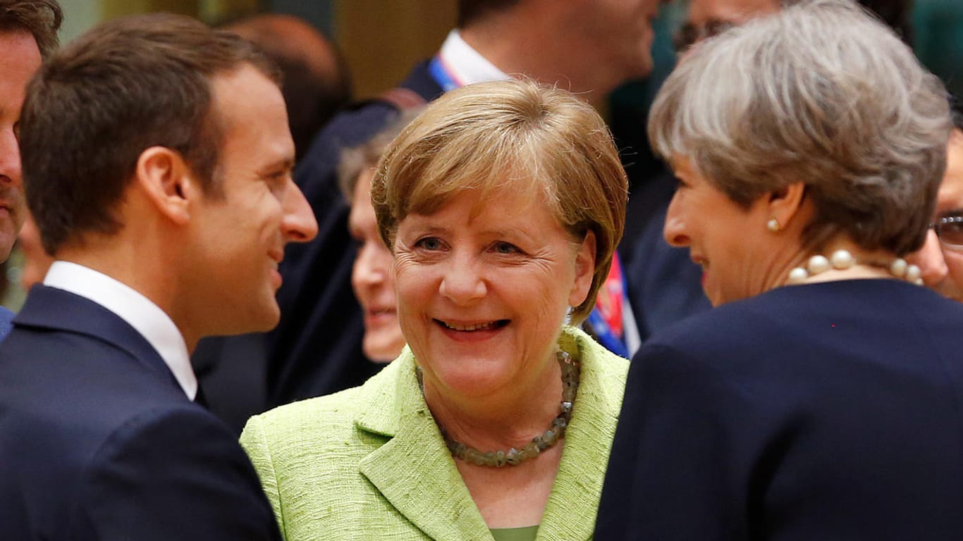 Ganz so fröhlich wird es zwischen Emmanuel Macron, Angela Merkel und Theresa May auf dem EU-Gipfel in Brüssel nicht zugehen.