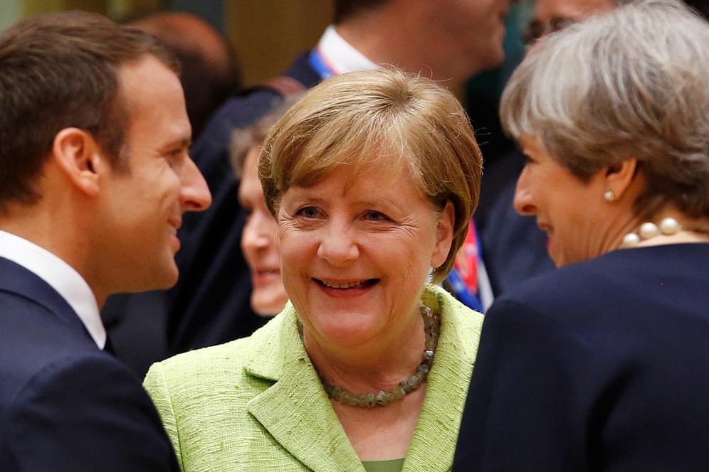 Ganz so fröhlich wird es zwischen Emmanuel Macron, Angela Merkel und Theresa May auf dem EU-Gipfel in Brüssel nicht zugehen.