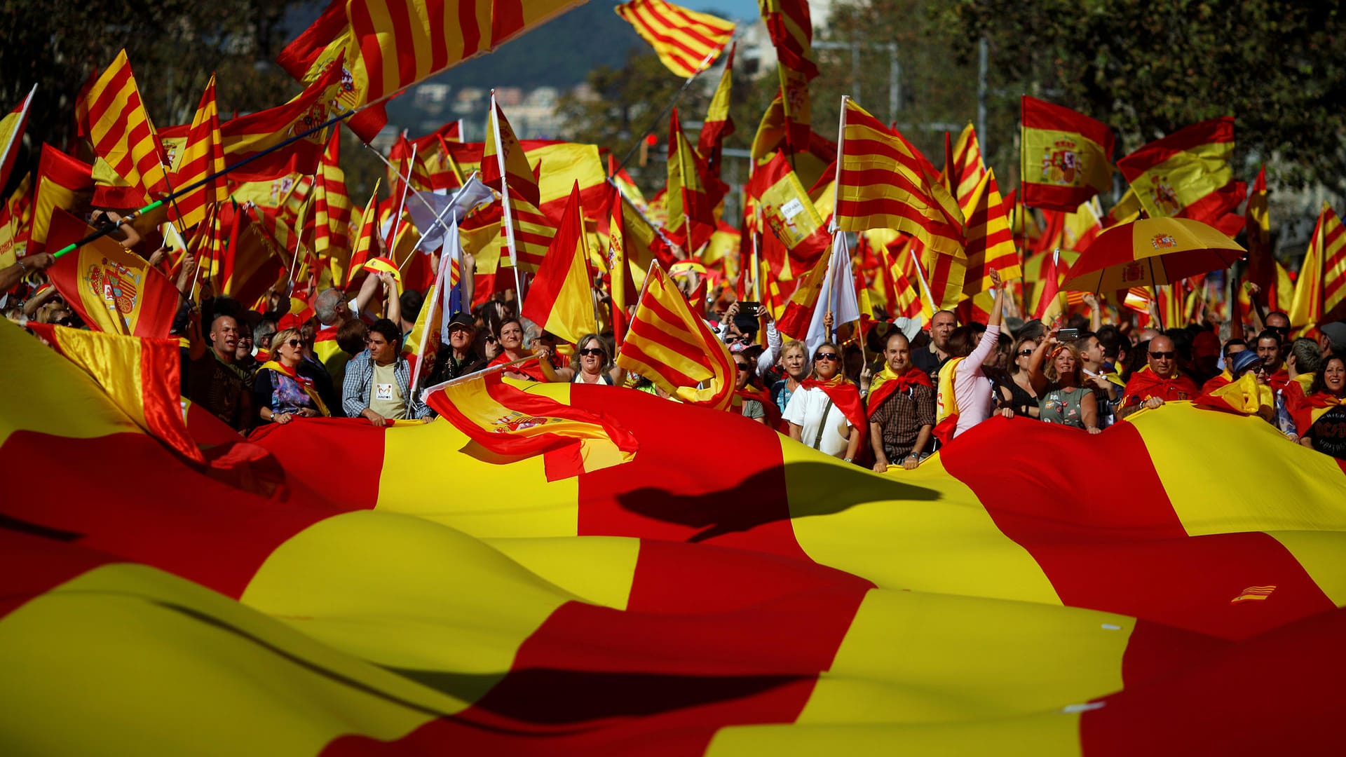 Pro-unity supporters take part in a demonstration in central Barcelona