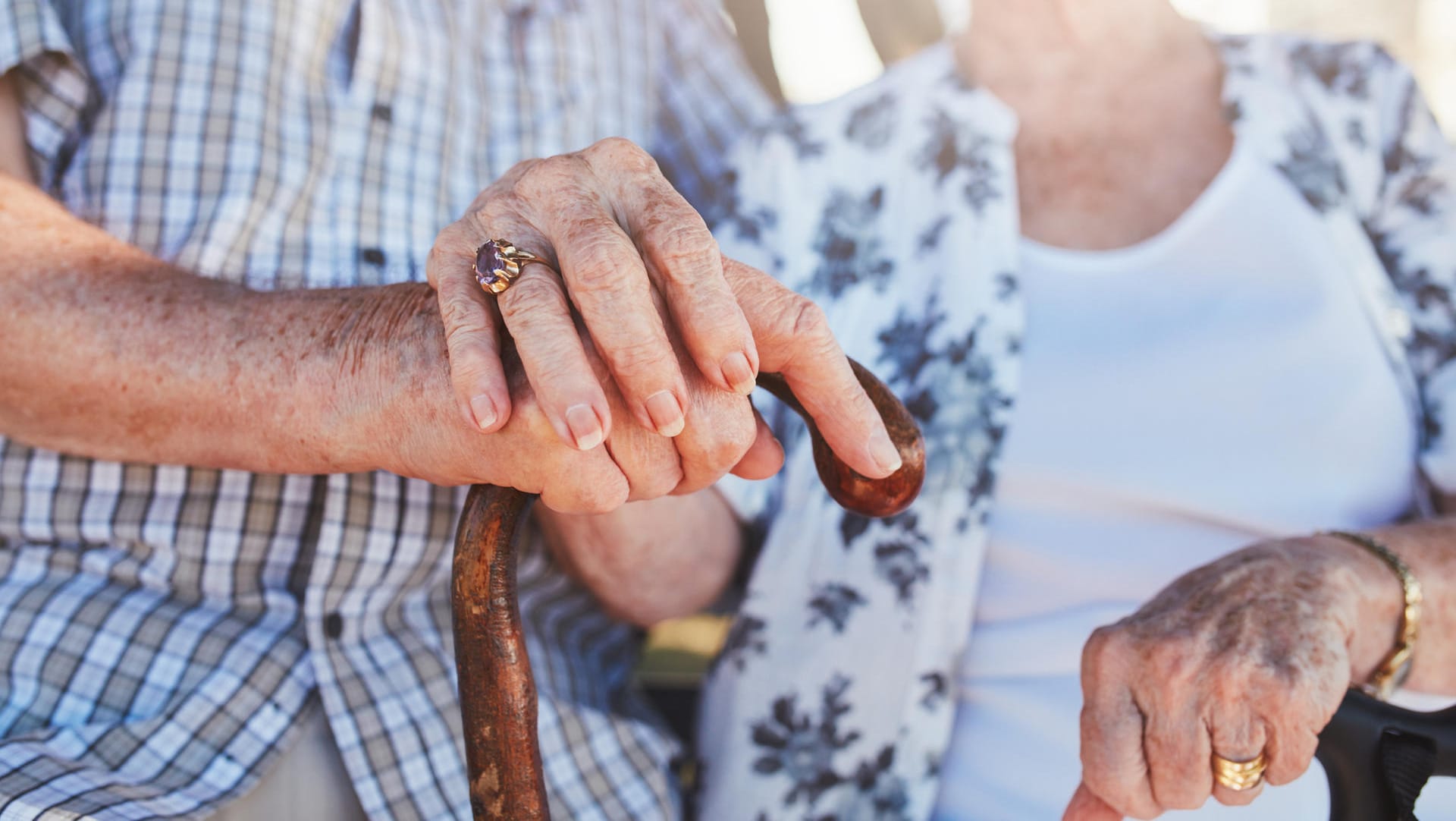 Senior couple holding hands