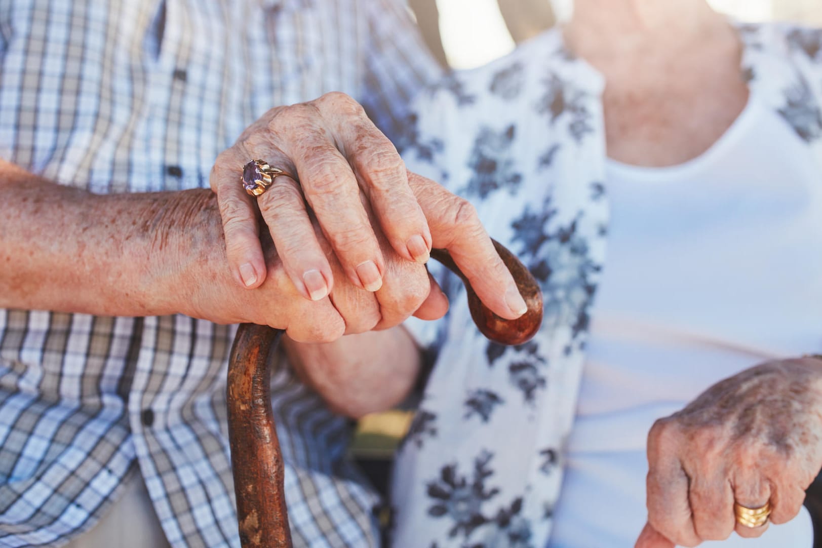 Senior couple holding hands