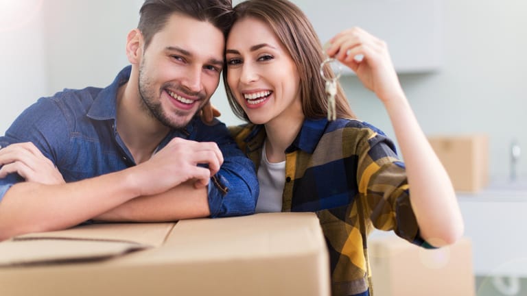 New home owners with key