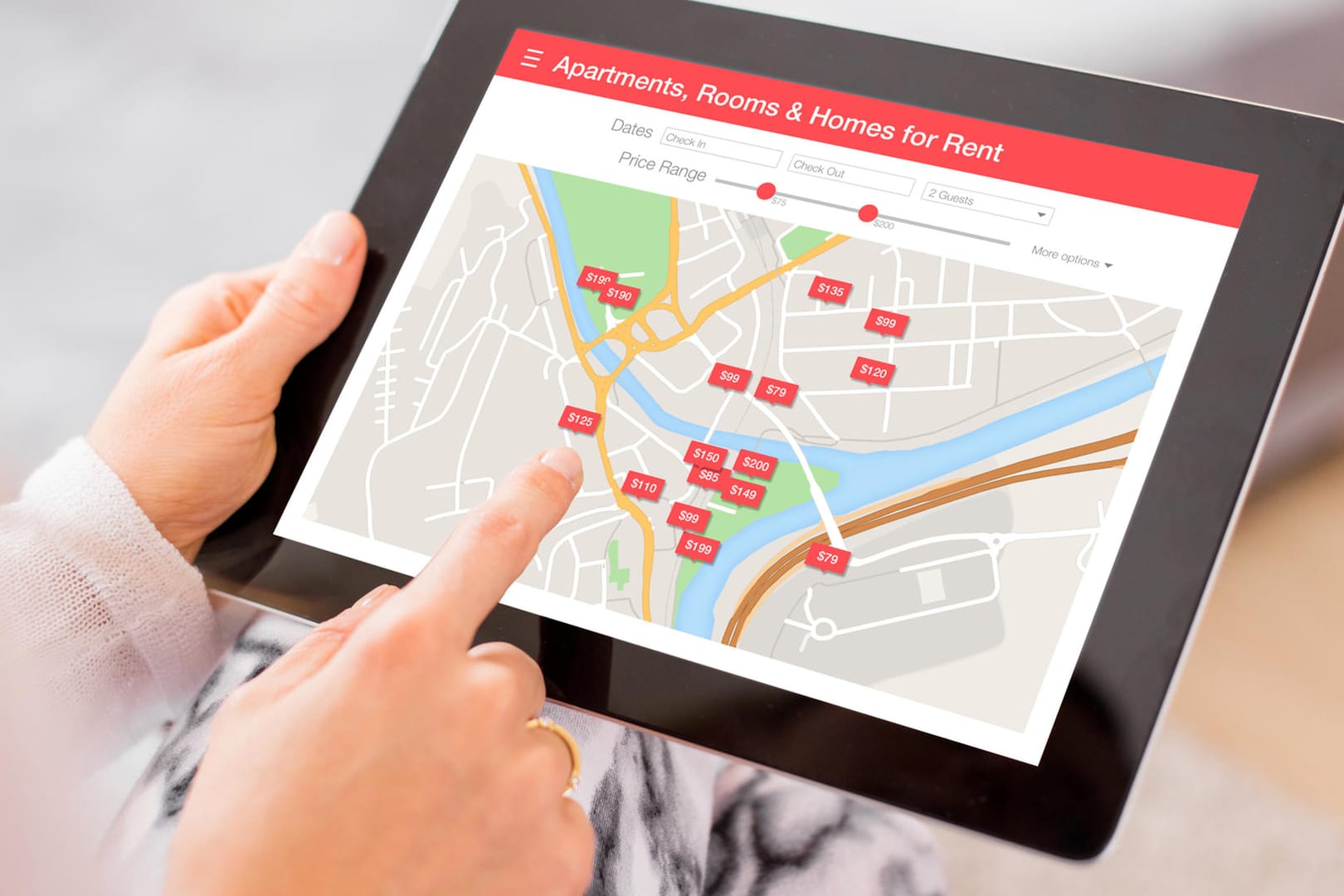 Person looking for places to stay on digital tablet app