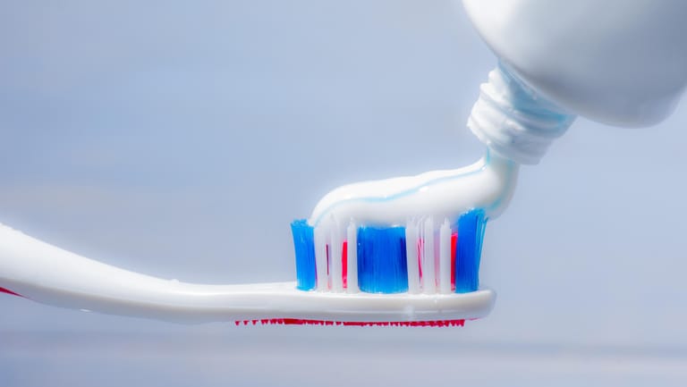 Tooth brush with tooth paste isolated.