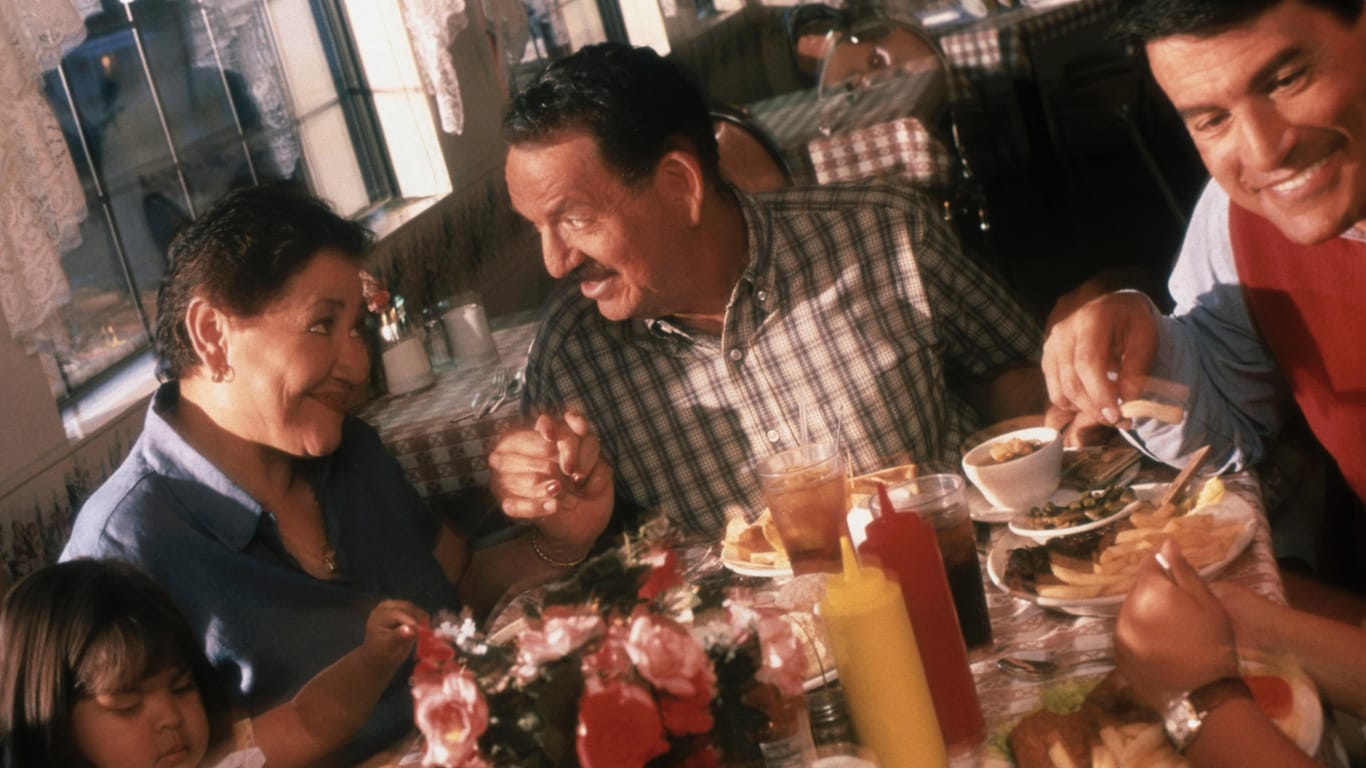 latino family eating in restaurant