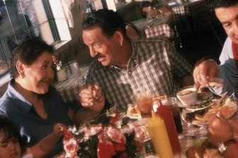 latino family eating in restaurant