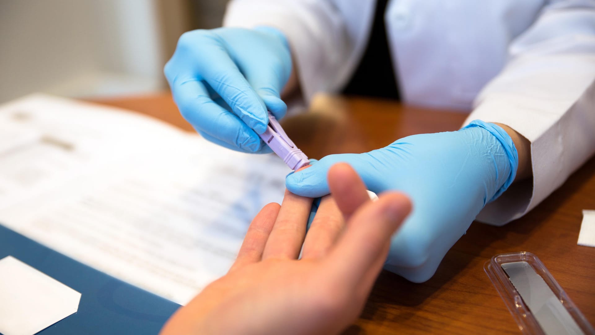 Patient getting a blood test from a doctor