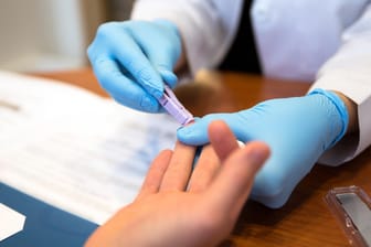 Patient getting a blood test from a doctor