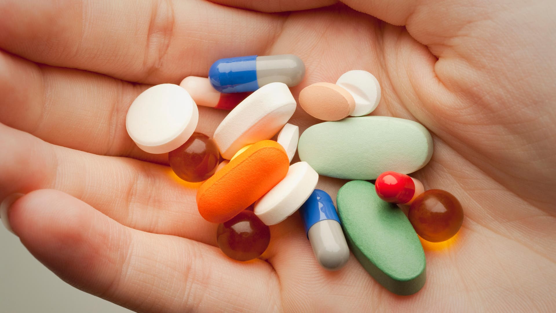 Pills on person's palm Pills on person's palm