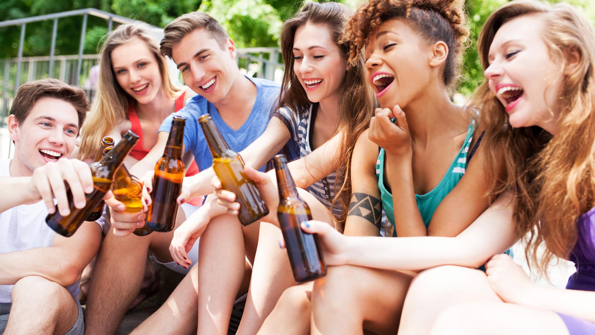 Friends toasting with beer