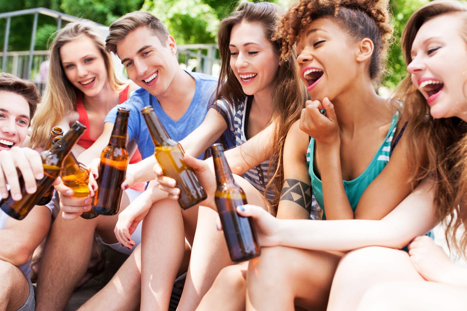 Friends toasting with beer