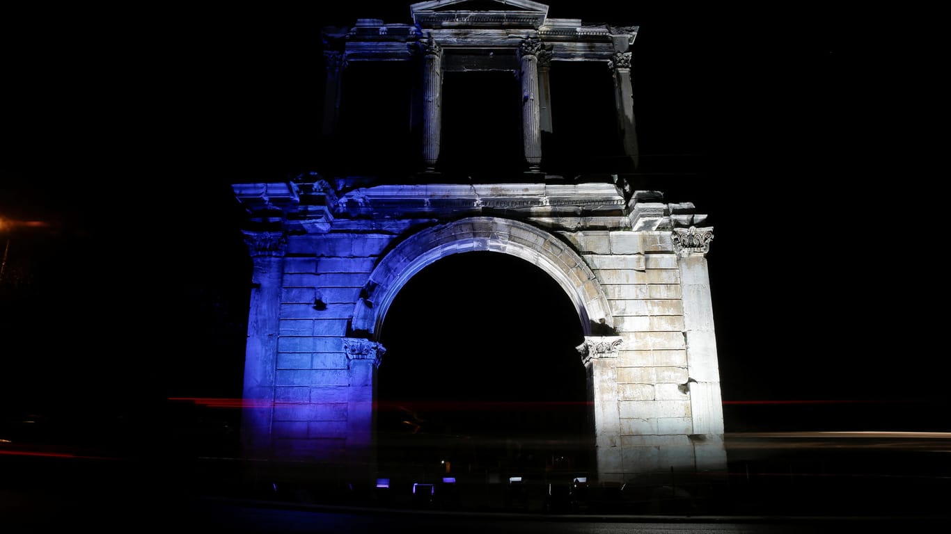 Hadrian's Gate is lit up in Finland's blue and white colours in Athens