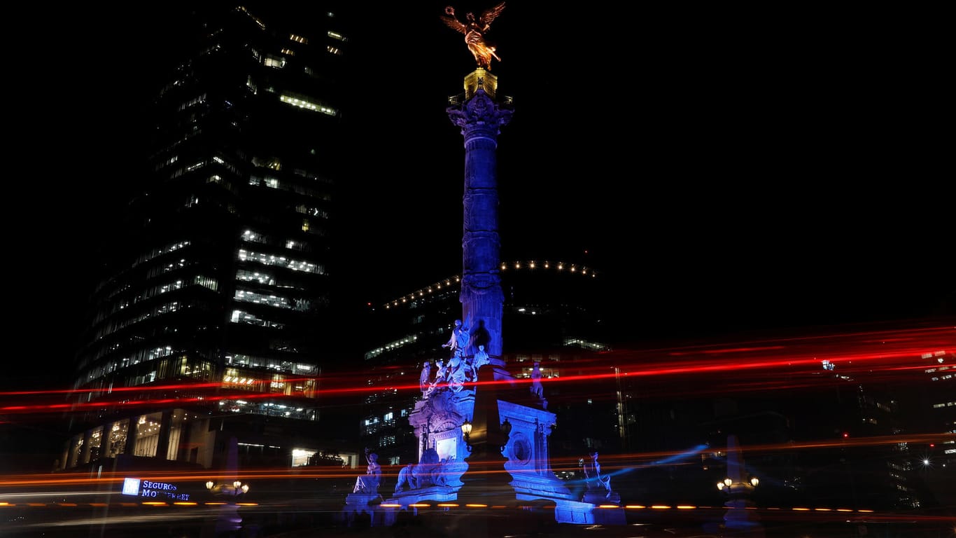A long exposure picture shows The Angel of independence in Mexico City lit up in Finland's blue and white colours to celebrate the 100 year anniversary of Finland's independence