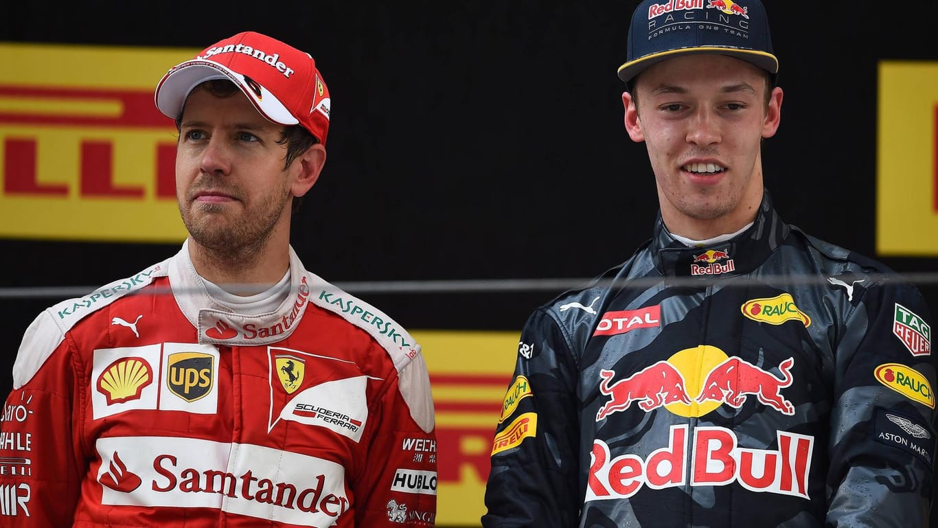 Jetzt bei einem Rennstall: Daniil Kwjat (r., hier noch im Red-Bull-Rennanzug) und Sebastian Vettel fahren in der Formel-1-Saison 2018 für Ferrari.