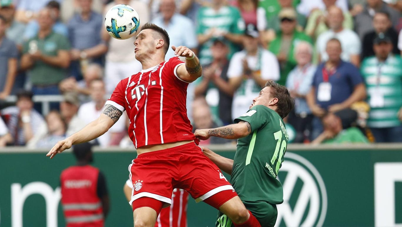 Bayerns Niklas Süle klärt gegen Werders Max Kruse: Am 19. Spieltag kommt es wieder zum Duell.
