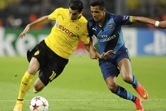 Im BVB-Trikot: Henrikh Mkhitaryan (l.) traf in der Champions-League-Saison 2014/15 damals noch mit Borussia Dortmund auf Alexis Sanchez' im Trikot des FC Arsenal.