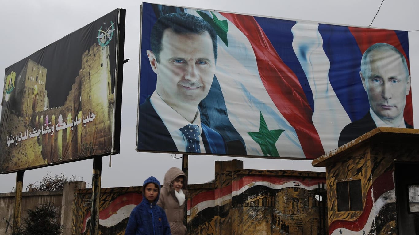 Assad, Putin auf einem Plakat in Aleppo: Der syrische und der russische Präsident sind verbündet.