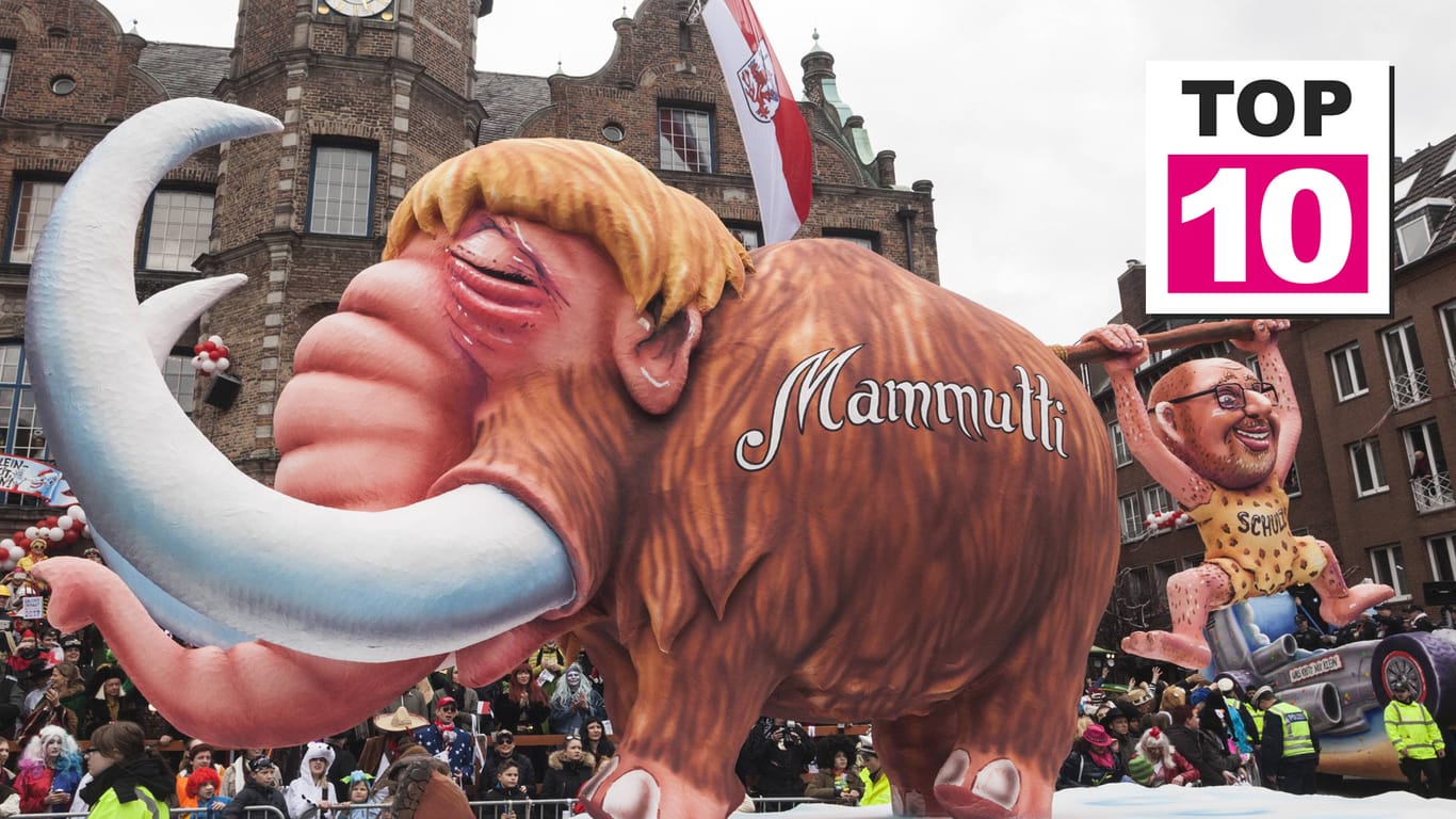 Motivwagen im Karneval 2017: Beim Düsseldorfer Rosenmontagszug sind die Wagen oft besonders bissig und frech. Im vergangenen Jahr wurden Angela Merkel und Martin Schulz als Mammut und Steinzeitmensch karikiert.