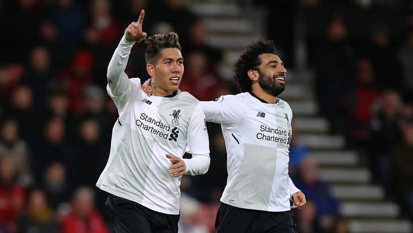 Roberto Firmino (l.) und Mo Salah: Mit ihrem Mitspieler Sadio Mané bilden sie beim FC Liverpool eine der besten Offensivreihen der Welt.