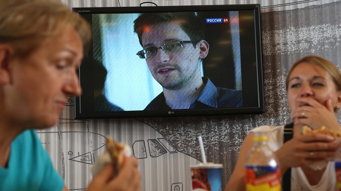 Edward Snowden at a display at Sheremetyevo airport in Moscow: He was stuck here for days.