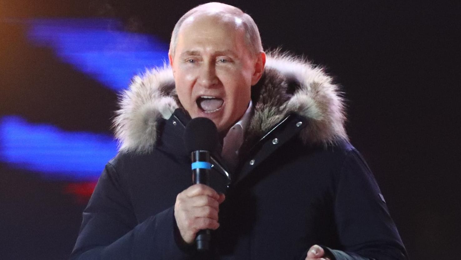 Russian President and Presidential candidate Putin delivers a speech during a rally and concert marking the fourth anniversary of Russia's annexation of the Crimea region, in central Moscow Russian President and Presidential candidate Putin delivers a speech during a rally and concert marking the fourth anniversary of Russia's annexation of the Crimea region, in central Moscow