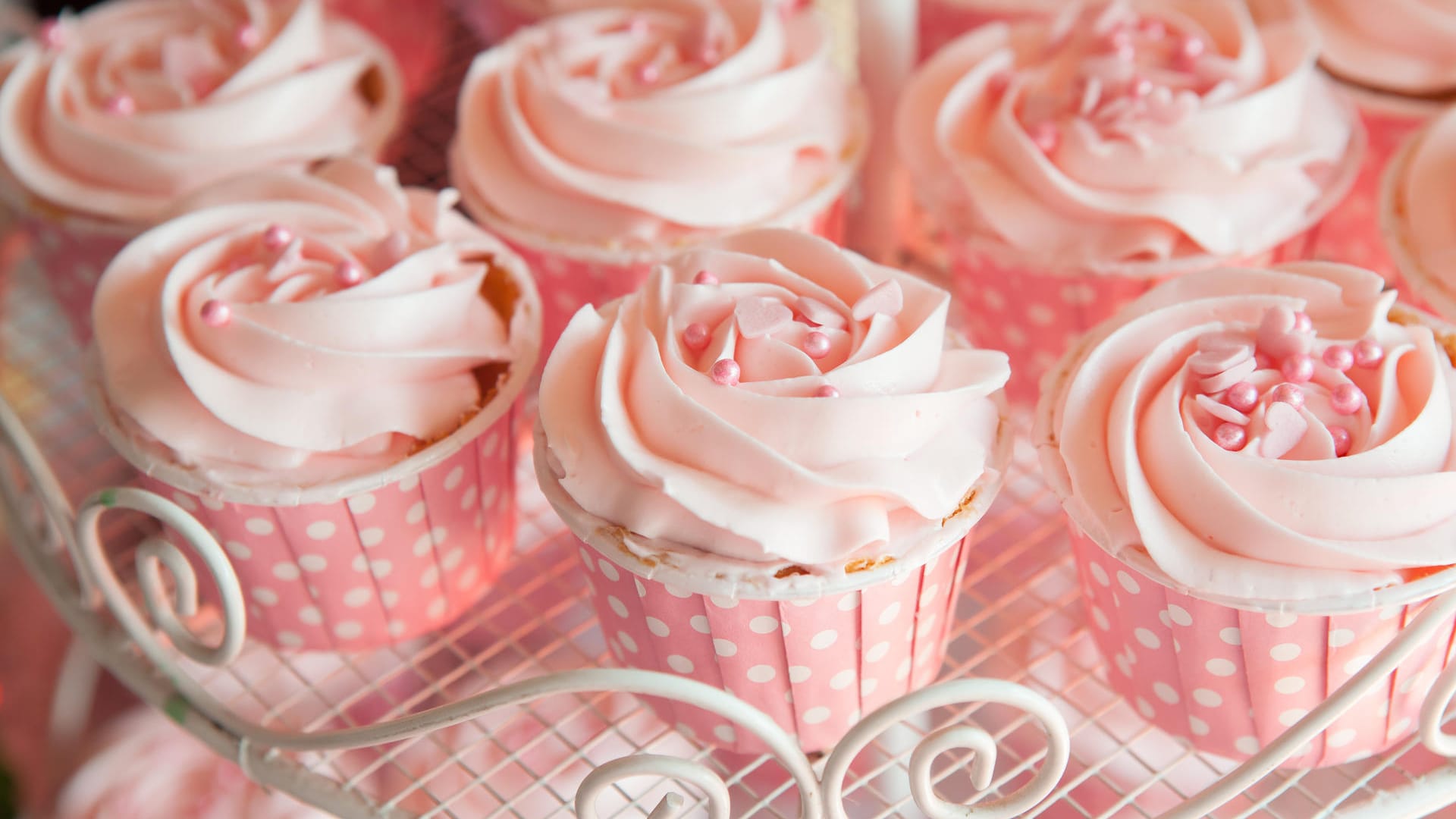 Pink cupcakes on shelf for wedding or valentine Pink cupcakes on shelf for wedding or valentine