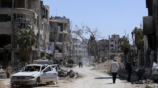 Zerstörter Straßenzug in einem Vorort der syrischen Hauptstadt Damaskus. Zerstörter Straßenzug in einem Vorort der syrischen Hauptstadt Damaskus.
