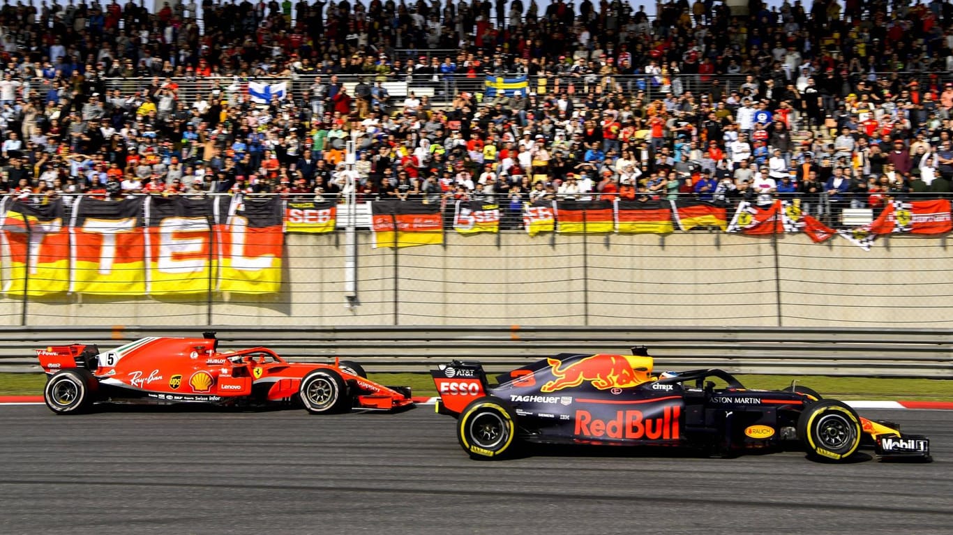 Sebastian Vettel (links) gegen Daniel Ricciardo: Ab 2021 könnte es Formel-1-Duelle auch in Berlin geben.