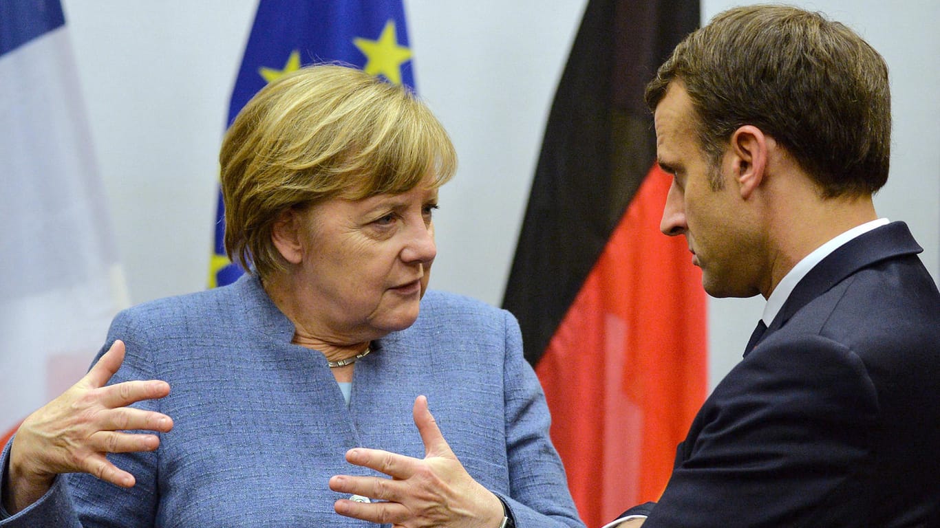 Bundeskanzlerin Angela Merkel (CDU) und der französische Präsident Emmanuel Macron: Wie reagiert die EU auf die Iran-Entscheidung Trumps?