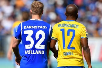 Zwei der sechs bedrohten Klubs: Darmstadt mit Fabian Holland (l.) und Braunschweig mit Domi Kumbela.
