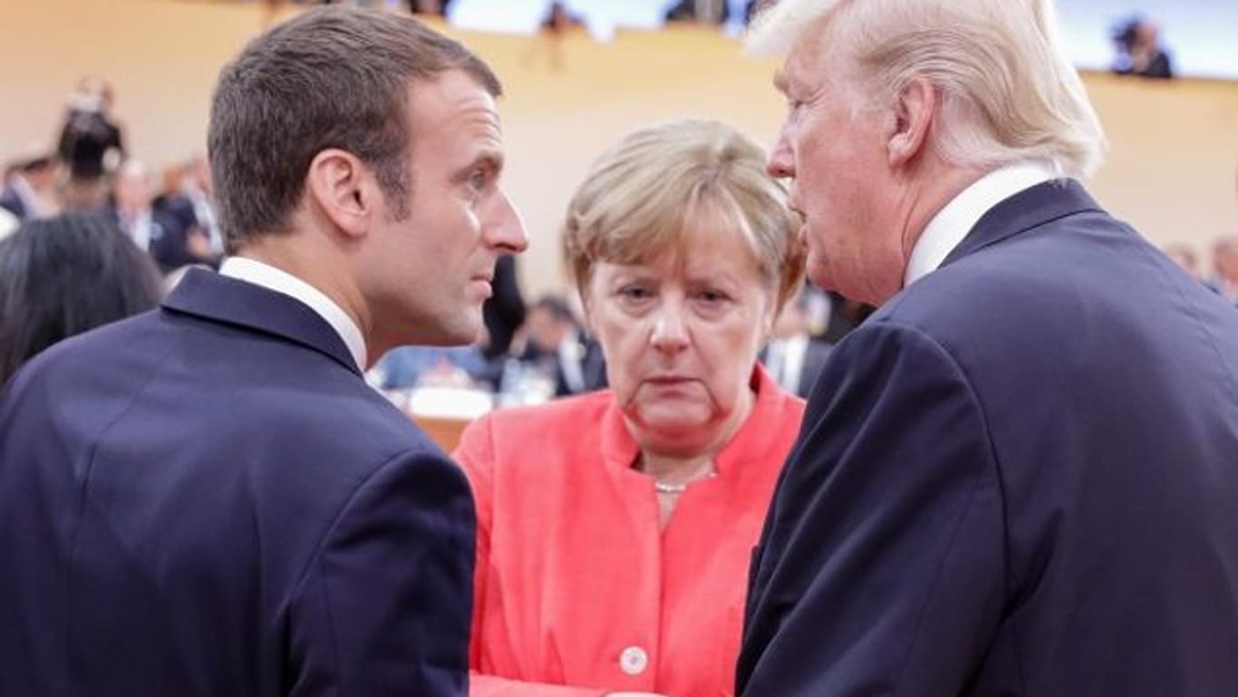 Emmanuel Macron, Angela Merkel und Donald Trump