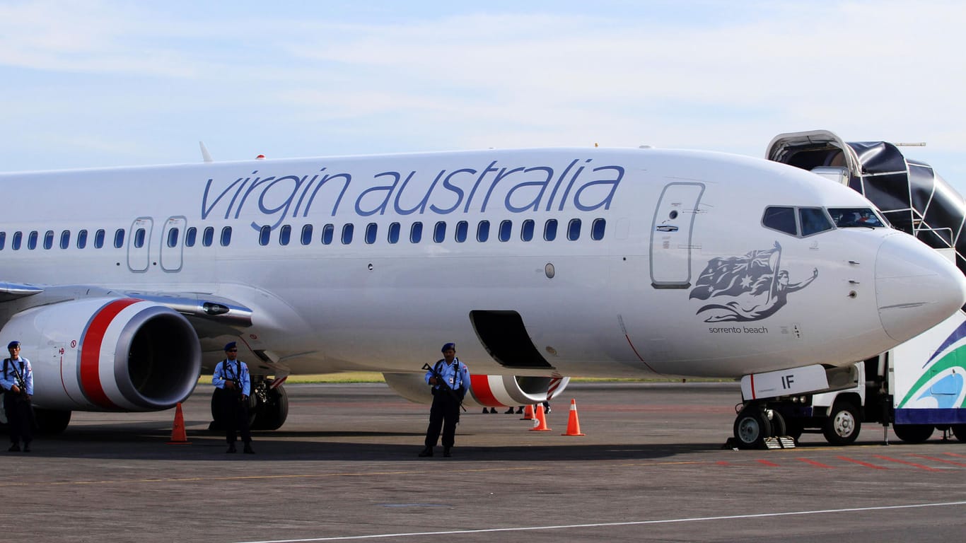 Flugzeug der Fluggesellschaft "virgin australia": Flugzeug muss Zwischenstopp einlegen, weil eine Frau drohte, Menschen umzubringen.