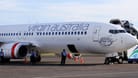 Flugzeug der Fluggesellschaft "virgin australia": Flugzeug muss Zwischenstopp einlegen, weil eine Frau drohte, Menschen umzubringen.