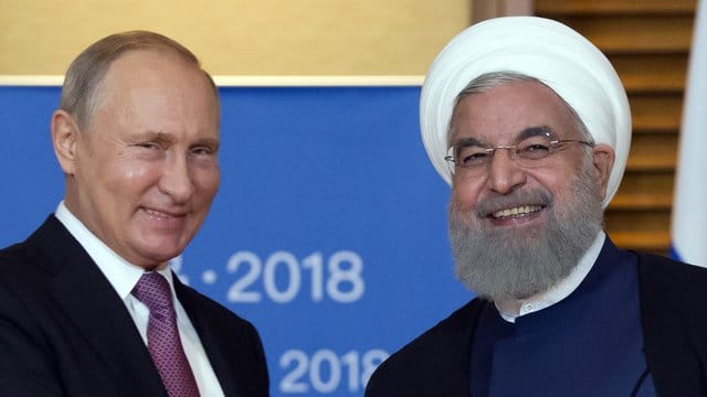 Wladimir Putin und Hassan Ruhani bei einem Treffen in China: Der Iran bemüht sich um größere Nähe zu Russland. Wladimir Putin und Hassan Ruhani bei einem Treffen in China: Der Iran bemüht sich um größere Nähe zu Russland.