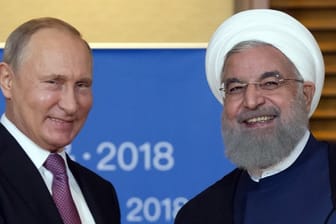 Wladimir Putin und Hassan Ruhani bei einem Treffen in China: Der Iran bemüht sich um größere Nähe zu Russland.