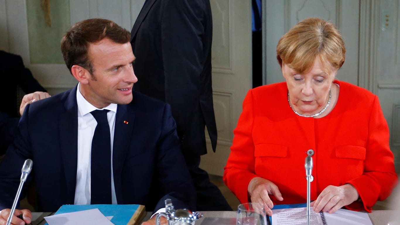 Kanzlerin Merkel und Frankreichs Präsident Macron auf Schloss Meseberg: Beim deutsch-französischen Ministerratstreffen einigten sich beide Länder auf eine Zusammenarbeit bei der Flüchtlingsfrage. Von einer europäischen Flüchtlingspolitik ist das aber noch weit entfernt.