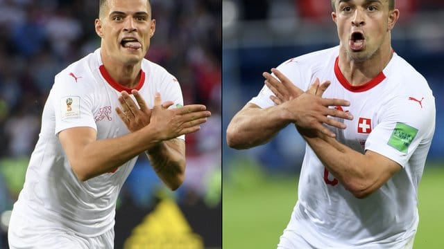 Granit Xhaka (l) und Xherdan Shaqiri (r) bildeten beim Torjubel mit den Händen symbolisch einen Vogel nach - wohl den doppelköpfigen albanischen Adler. Granit Xhaka (l) und Xherdan Shaqiri (r) bildeten beim Torjubel mit den Händen symbolisch einen Vogel nach - wohl den doppelköpfigen albanischen Adler.