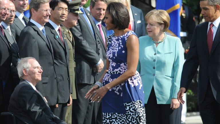 Zwei Frauen, die unterschiedlicher kaum sein könnten: Michelle Obama (l.) und Angela Merkel (r.).