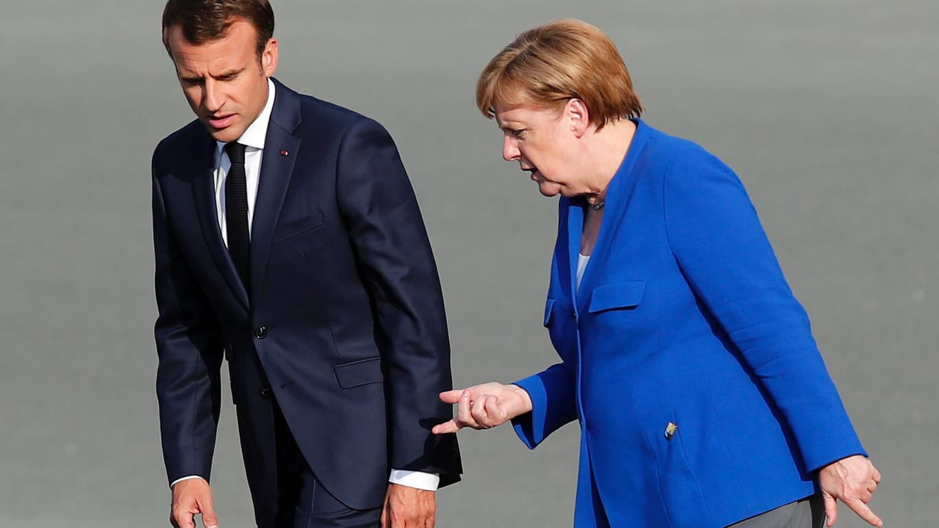 Kanzlerin Angela Merkel und der französische Präsident Emmanuel Macron beim Nato-Gipfel: US-Präsident Trump freute sich am zweiten Tag über die Zusage anderer Länder, die Militärausgaben zu erhöhen. Eine Bestätigung gab es dafür aber von anderer Seite nicht.