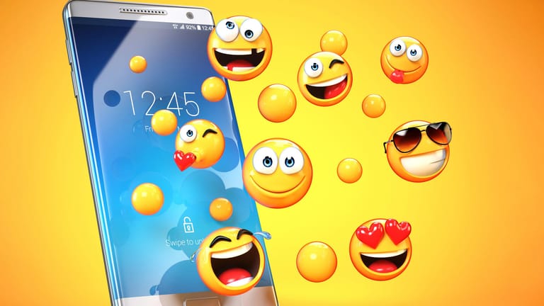 Emojis fliegen aus Smartphone